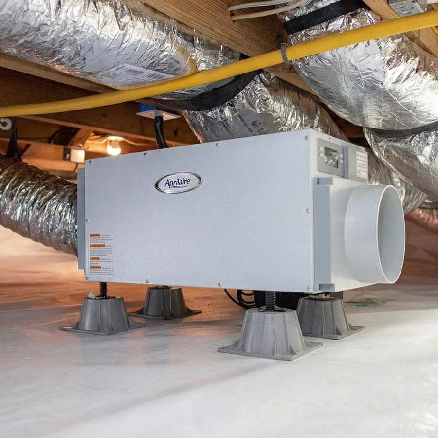Aprilaire whole-home dehumidifier installed in attic with HVAC ductwork