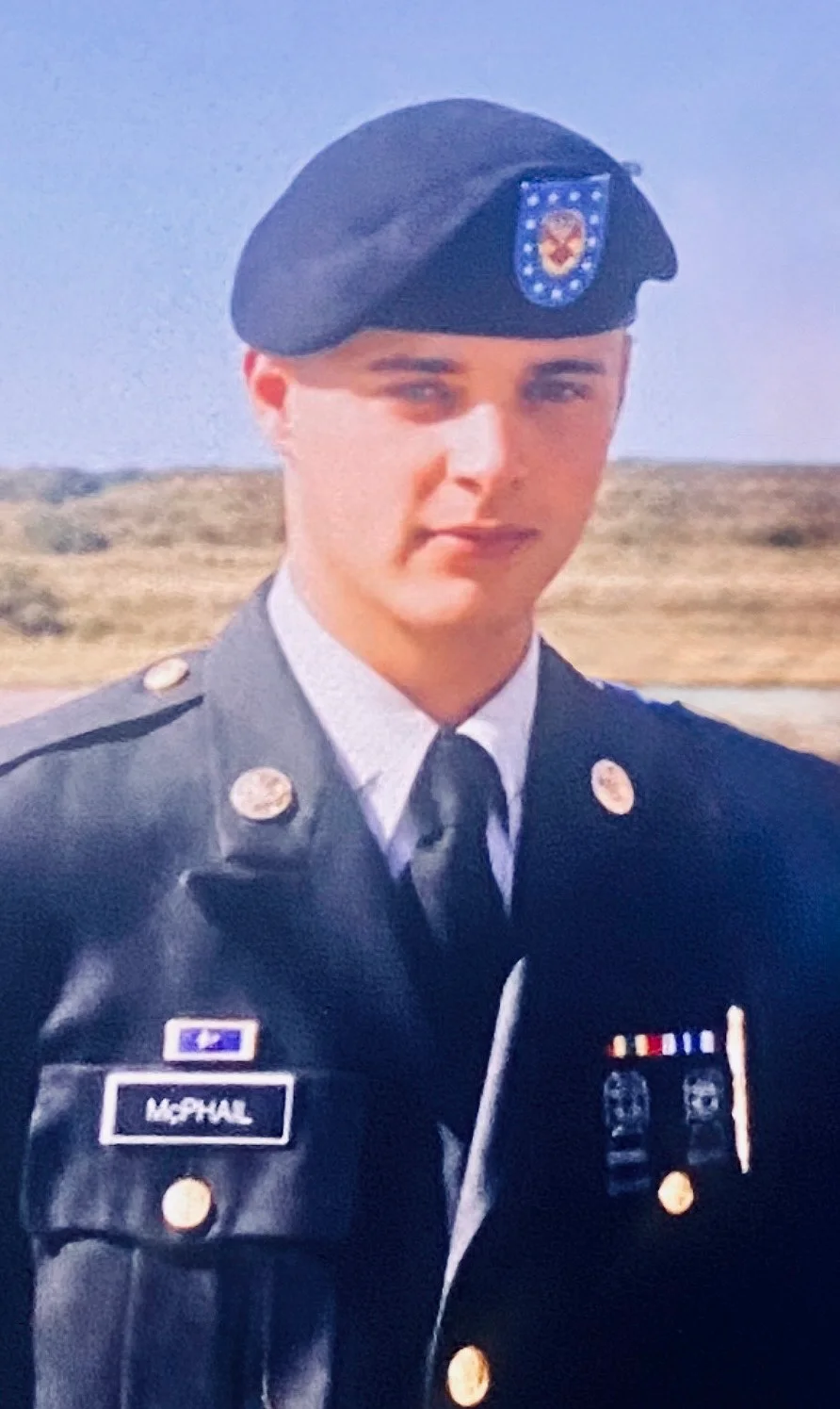 Brison McPhail in U.S. Army dress greens and black beret, name tape McPhail, photographed outdoors circa 2001