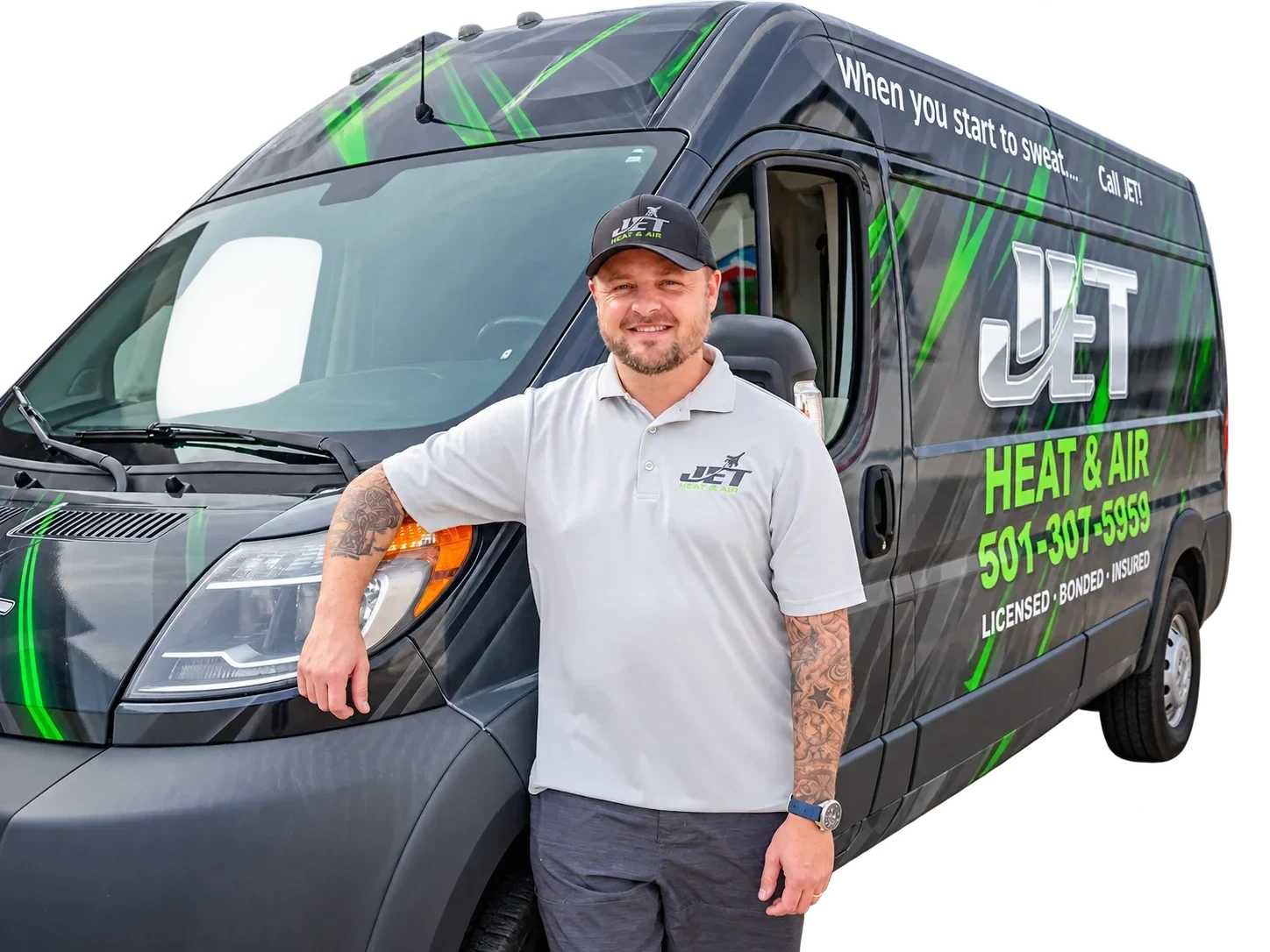 Brison McPhail, owner of Jet Heat and Air, beside a wrapped Jet service van