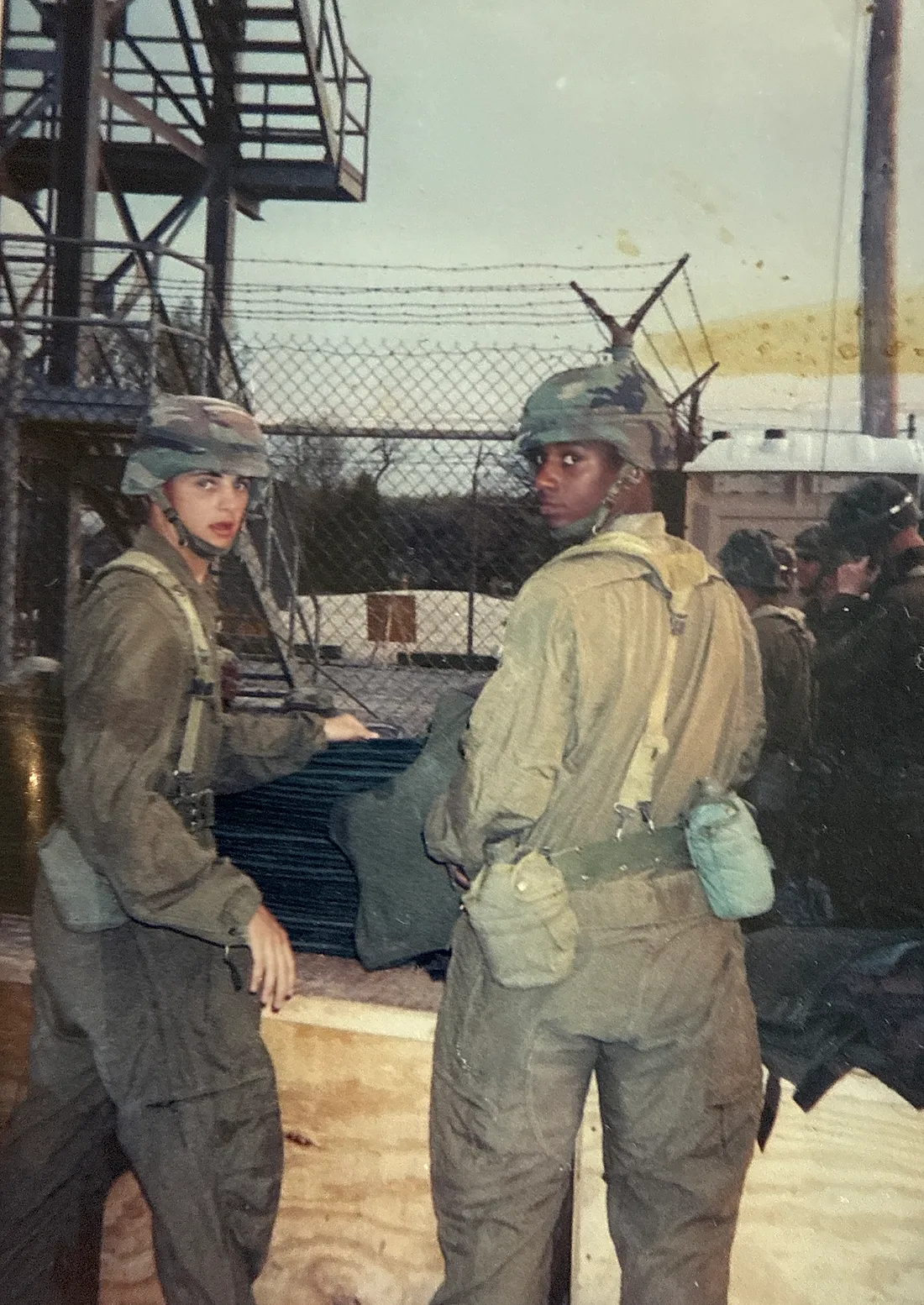 Brison McPhail, left, in BDUs and Kevlar helmet during U.S. Army basic training at Fort Knox, Kentucky, 2001