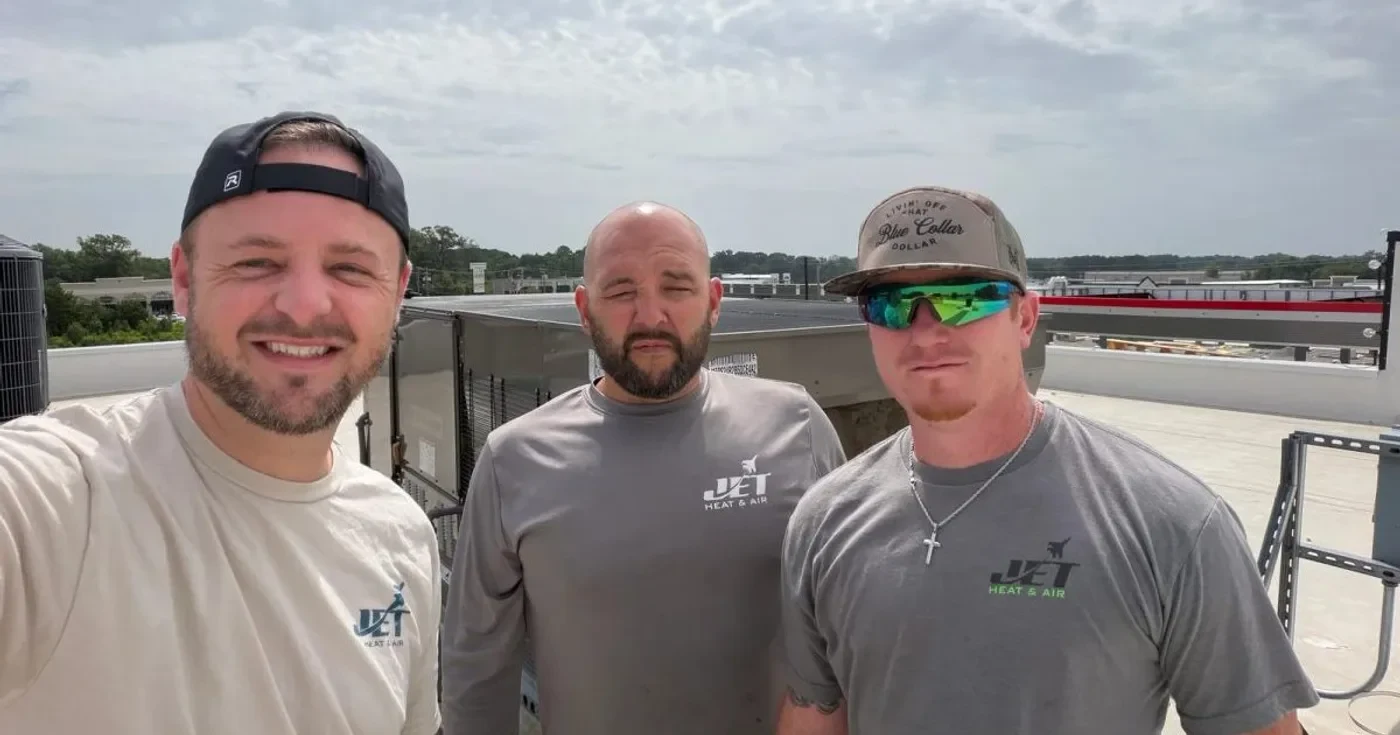 Jet Heat and Air technicians on a commercial rooftop HVAC job in Central Arkansas
