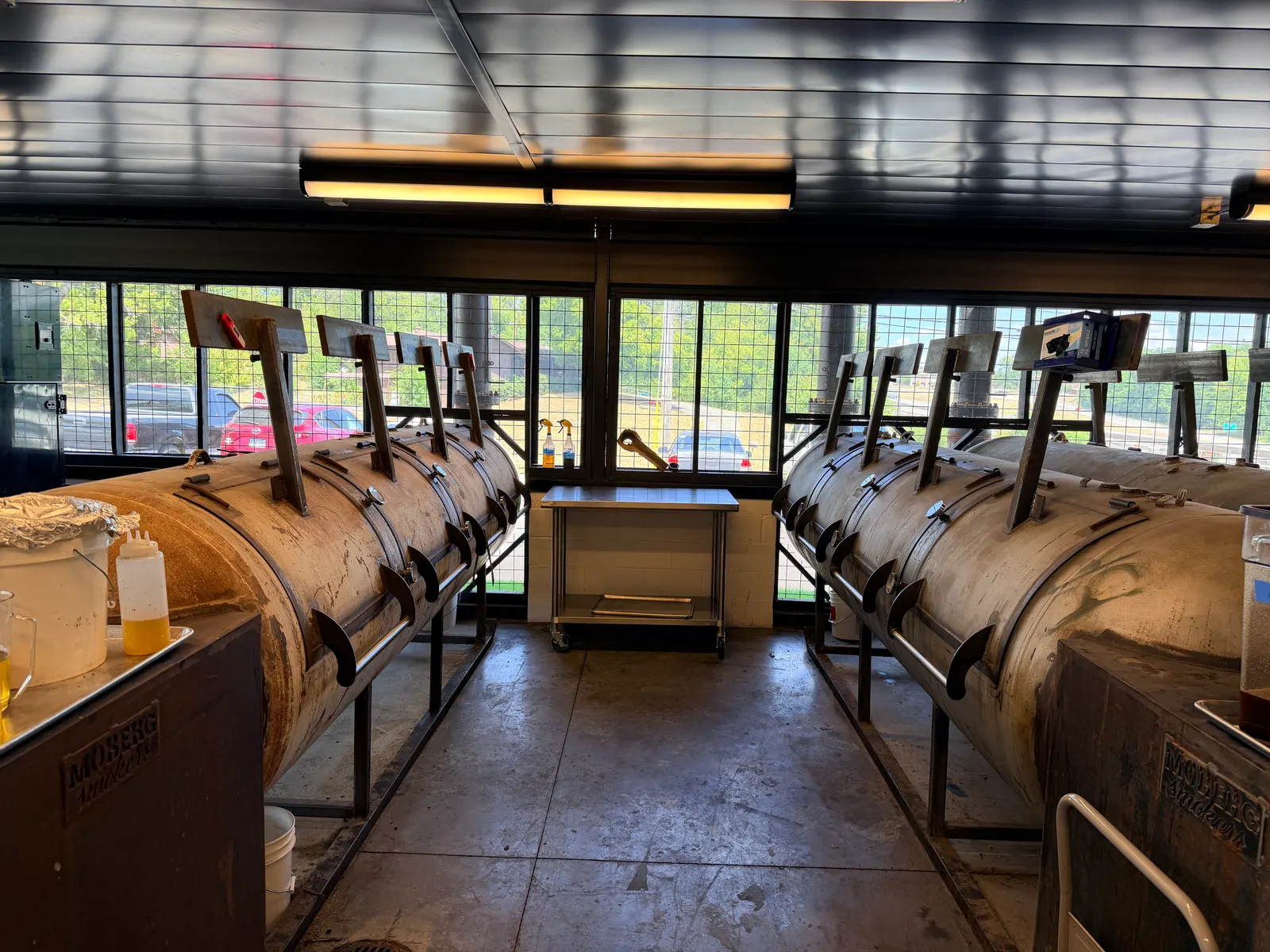 A row of large Moberg offset smokers inside the pit room at Wright's Barbecue in Benton